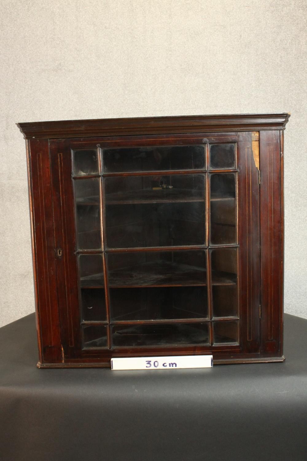 A George III mahogany corner cabinet, with a glazed door enclosing shelves. H.74 W.78 D.41cm. - Image 2 of 8