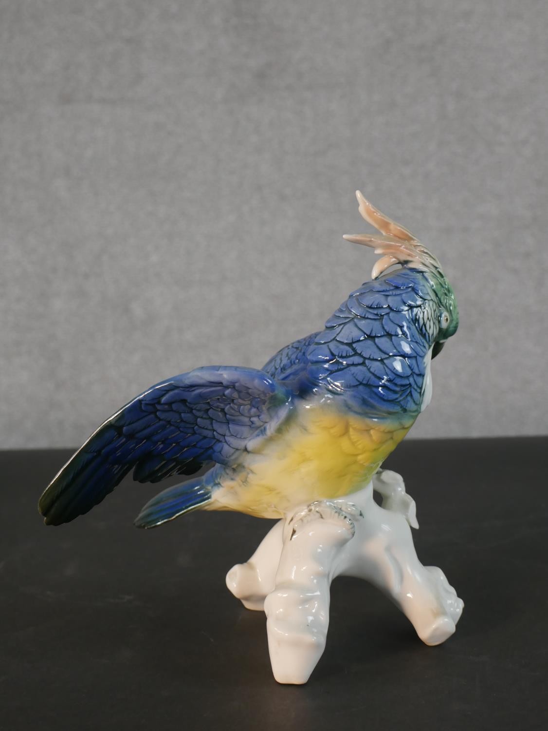 A Karl Ens porcelain blue and yellow parrot perched on a leafy branch, blue printed factory mark - Image 3 of 5