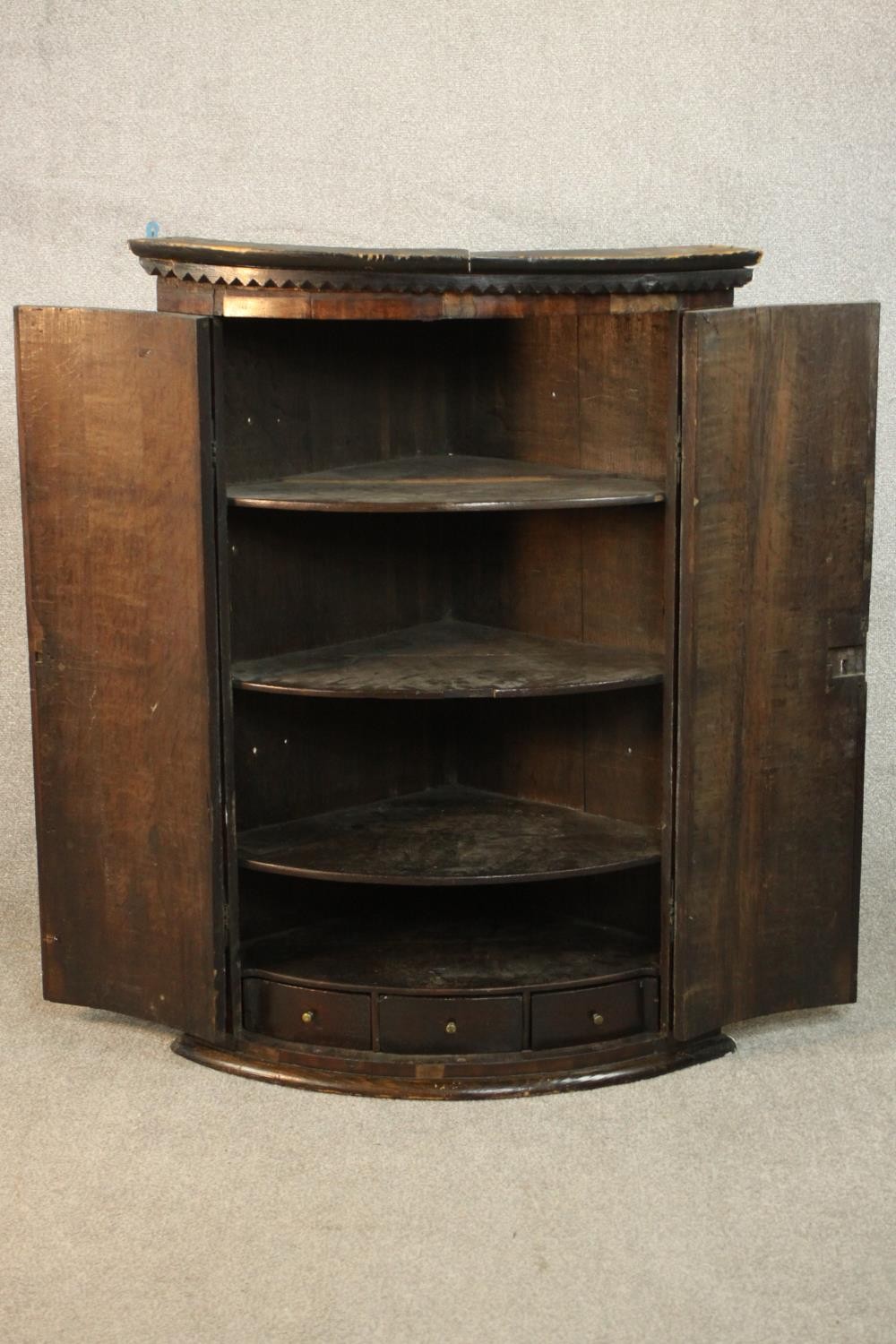 An 18th century bow front corner cabinet, with two doors enclosing shelves and three short - Image 3 of 7