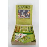 A vintage Subbuteo table football set with box and acrylic pieces. (complete).
