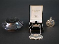 A collection of silver items, including two silver drinks labels, a Victorian silver and