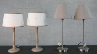 Two pairs of table lamps, one pair painted and turned and the other pair brushed chrome. H.49cm (