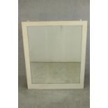 A rectangular mirror with a white painted frame. H.107 W.88cm.