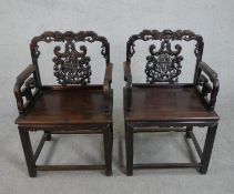 A pair of late Qing dynasty Chinese hardwood throne chairs, possibly hongmu or huanghuali, the