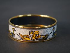 Hermès, a gold plated and enamel duck design bangle with white ground, makers mark to interior.