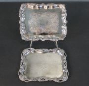 Two engraved floral design silver plated dishes with relief vine design to the borders. Stamped