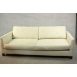 Meridiani, Italy; a contemporary three seater sofa with loose back and seat cushions, upholstered in