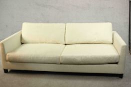 Meridiani, Italy; a contemporary three seater sofa with loose back and seat cushions, upholstered in