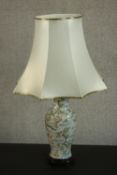 A late 20th century Chinese porcelain table lamp of baluster form decorated with flowers and