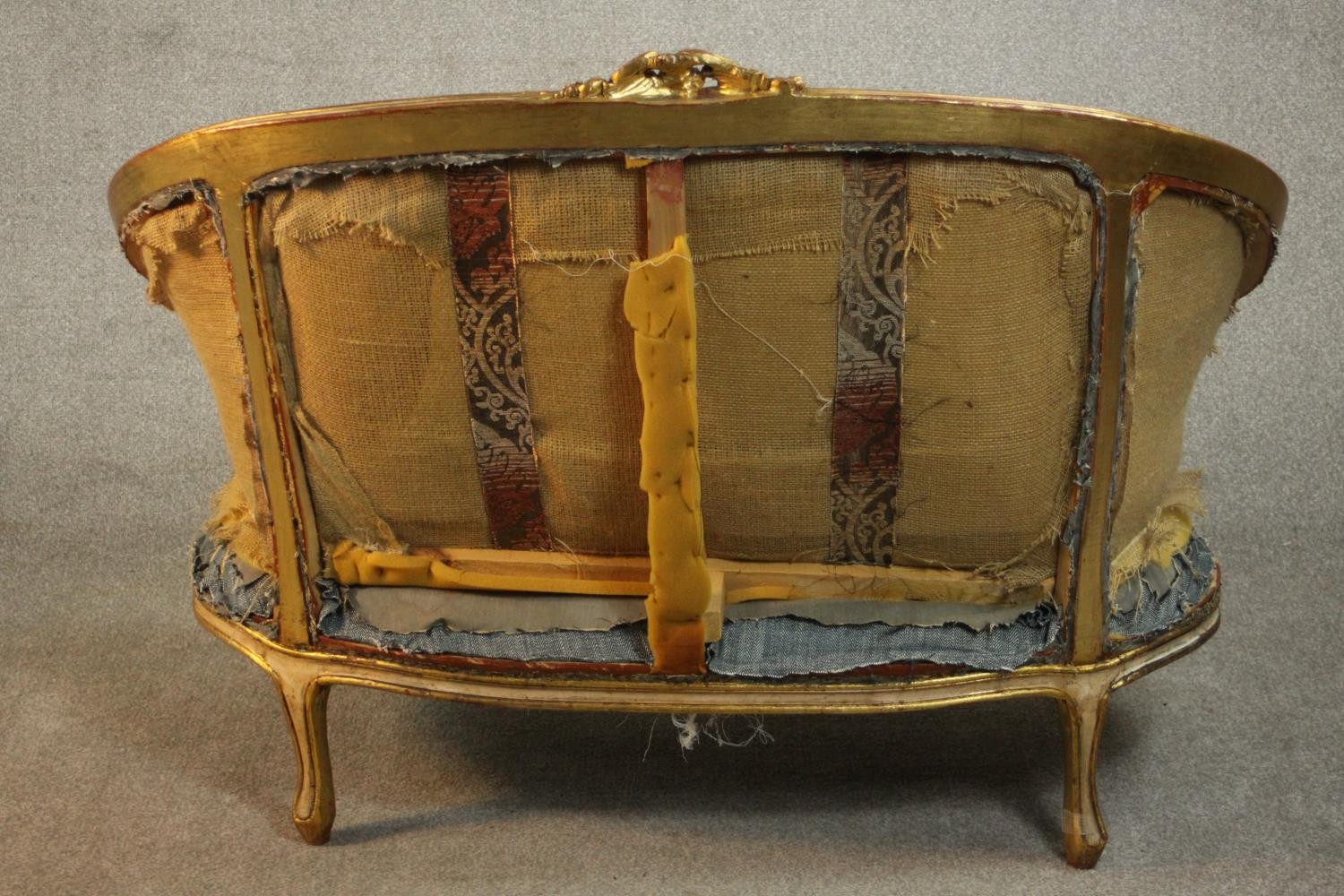 A Louis XV style giltwood canape sofa, with carved cresting and upholstered in blue fabric, with - Image 5 of 7