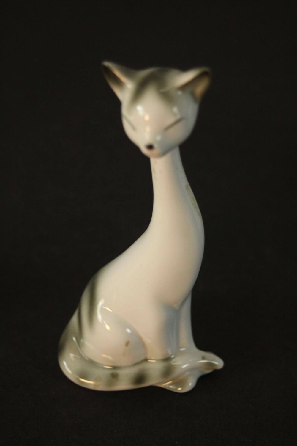Three German porcelain Siamese cats in three different sizes, makers mark to base. H.18 W.9 D.7cm. - Image 4 of 6
