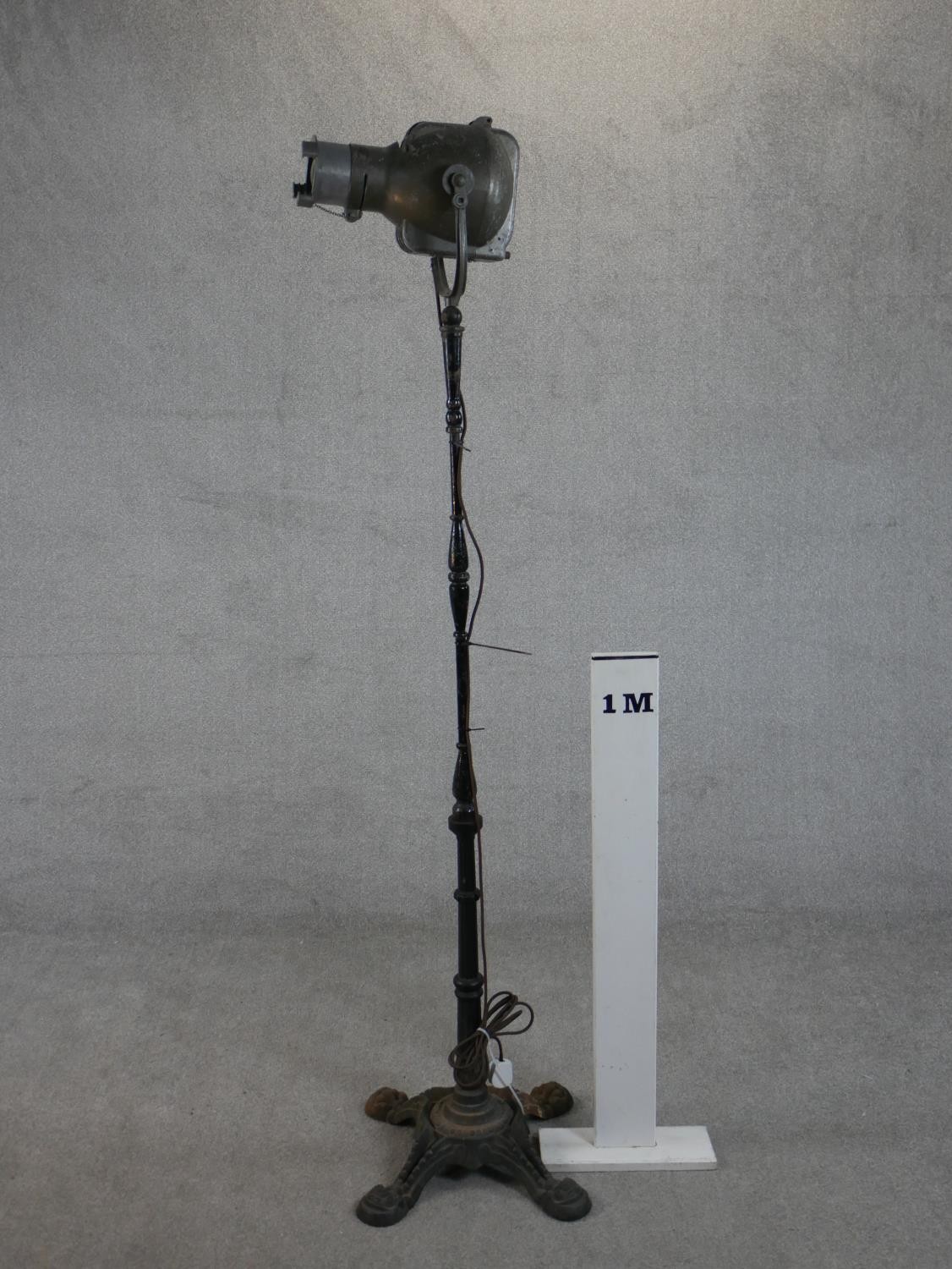 A Strand Electric theatre spotlight, on a cast iron stand. H.190 W.41 D.41cm - Image 2 of 6
