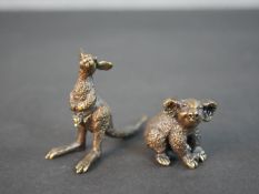 Pete Smit (20th Century), a Kangaroo with joey and Koala miniature bronze, signed to base. H.5.