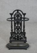 A 19th century black painted cast iron umbrella stand, with a removable drip tray. H.53 W.33 D.15cm