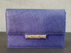 A boxed royal blue woven fibre and leather Gucci clutch bag with diamante band to the flap and snake