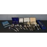 A collection of silver plated cutlery, including four sets of cased cutlery, various spoons, fish
