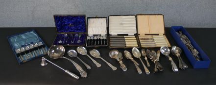 A collection of silver plated cutlery, including four sets of cased cutlery, various spoons, fish