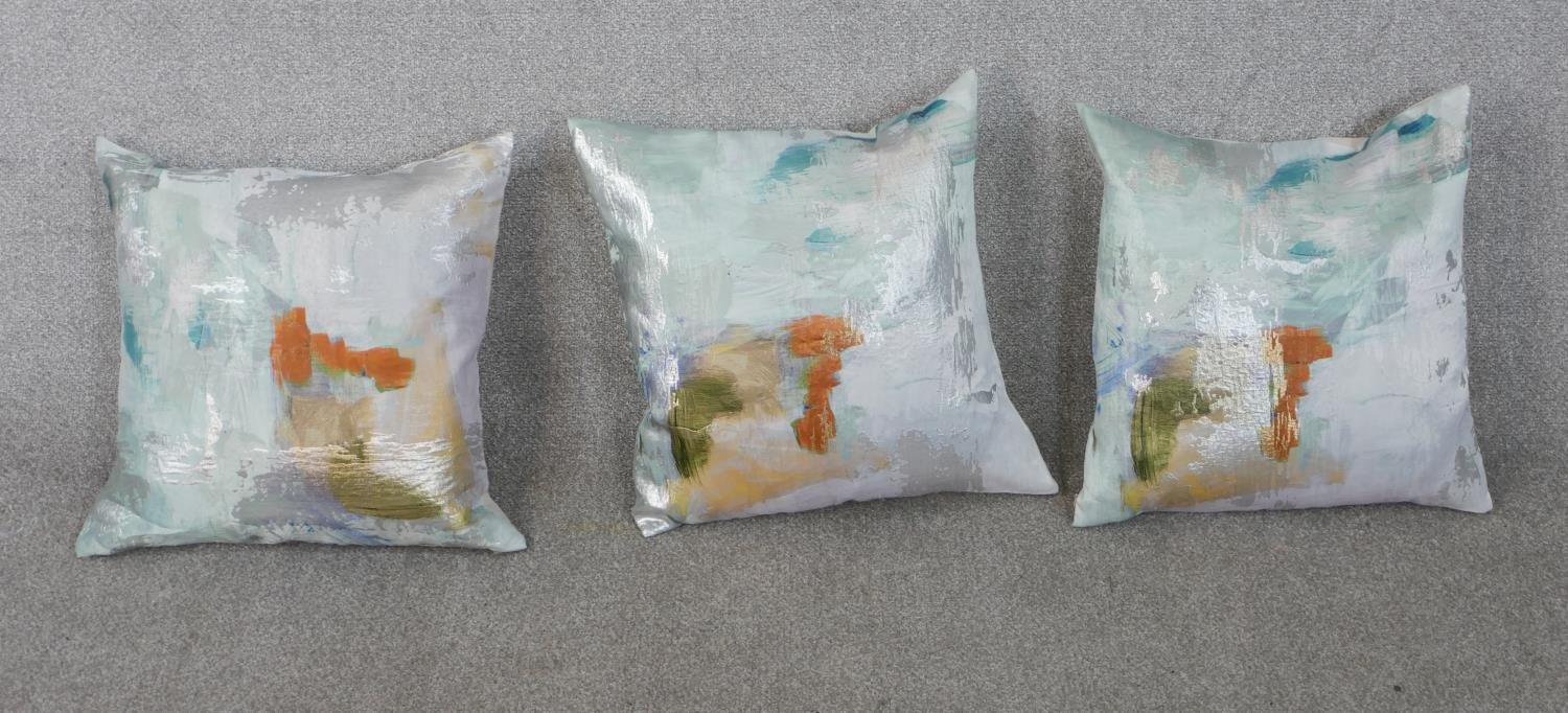 Three contemporary silk/cotton mix abstract colourful design cushions. H.50 W.50cm