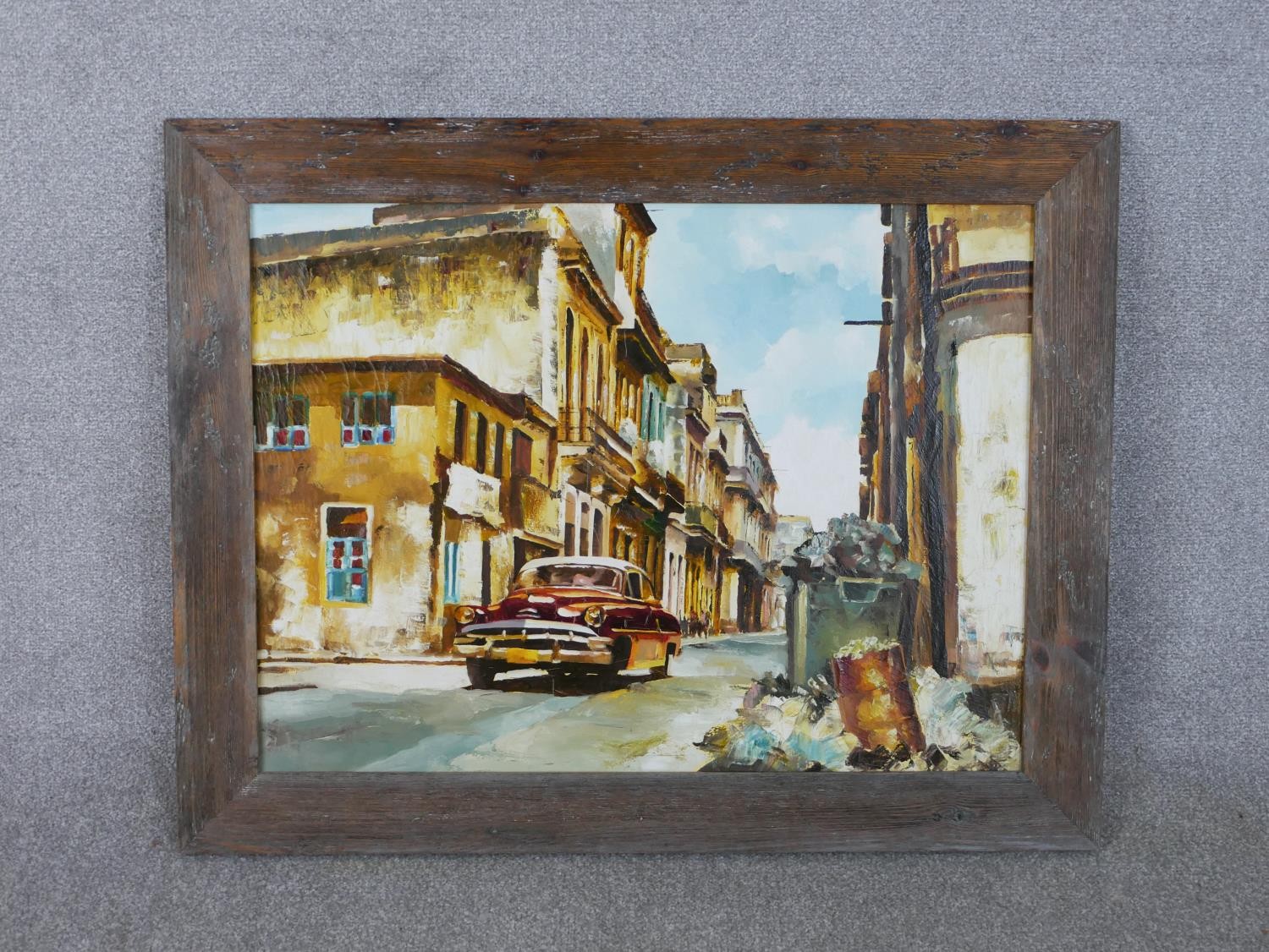A framed acrylic on canvas of a street scene with vintage car, unsigned. H.74 W.95cm - Image 2 of 4