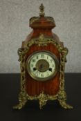 A 19th century gilt spelt ormolu and mahogany mantle clock with enamel chapter ring with black