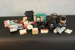 A collection of 35mm camera equipment and accessories. H.18 W.10 D.5cm. (largest)