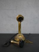 A Conversation Pieces candlestick style brass telephone, with horn shaped receiver, candlestick stem