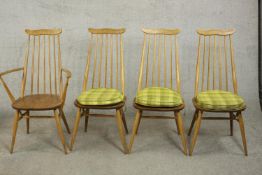 A set of four Ercol light elm and beech Goldsmith dining chairs, including three side chairs and one