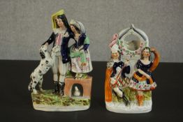 Two 19th century Staffordshire pottery flat back figures, a young couple with black and white