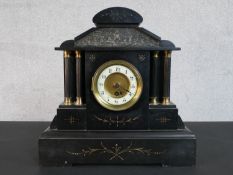 A Victorian slate marble mantle clock of architectural form, the enamelled chapter ring painted with