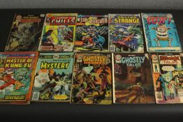 A collection of ten vintage comic books, including Plop, Master of Kung Fu, Doctor Strange and other