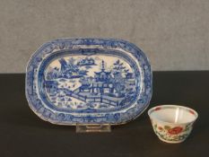 A 18th century Famille Rose tea bowl with floral design along with a blue and white Chinese hand