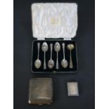 A collection of silver, including five shell design coffee spoons by Atkin Brothers, a silver
