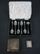 A collection of silver, including five shell design coffee spoons by Atkin Brothers, a silver