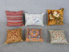 Six hand embroidered and printed contemporary cushions, one by Voyage Maison with wildflower