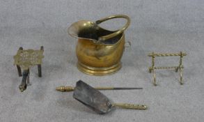 A collection of Victorian brass fireside items, including a coal bucket, a trivet, a shovel, a