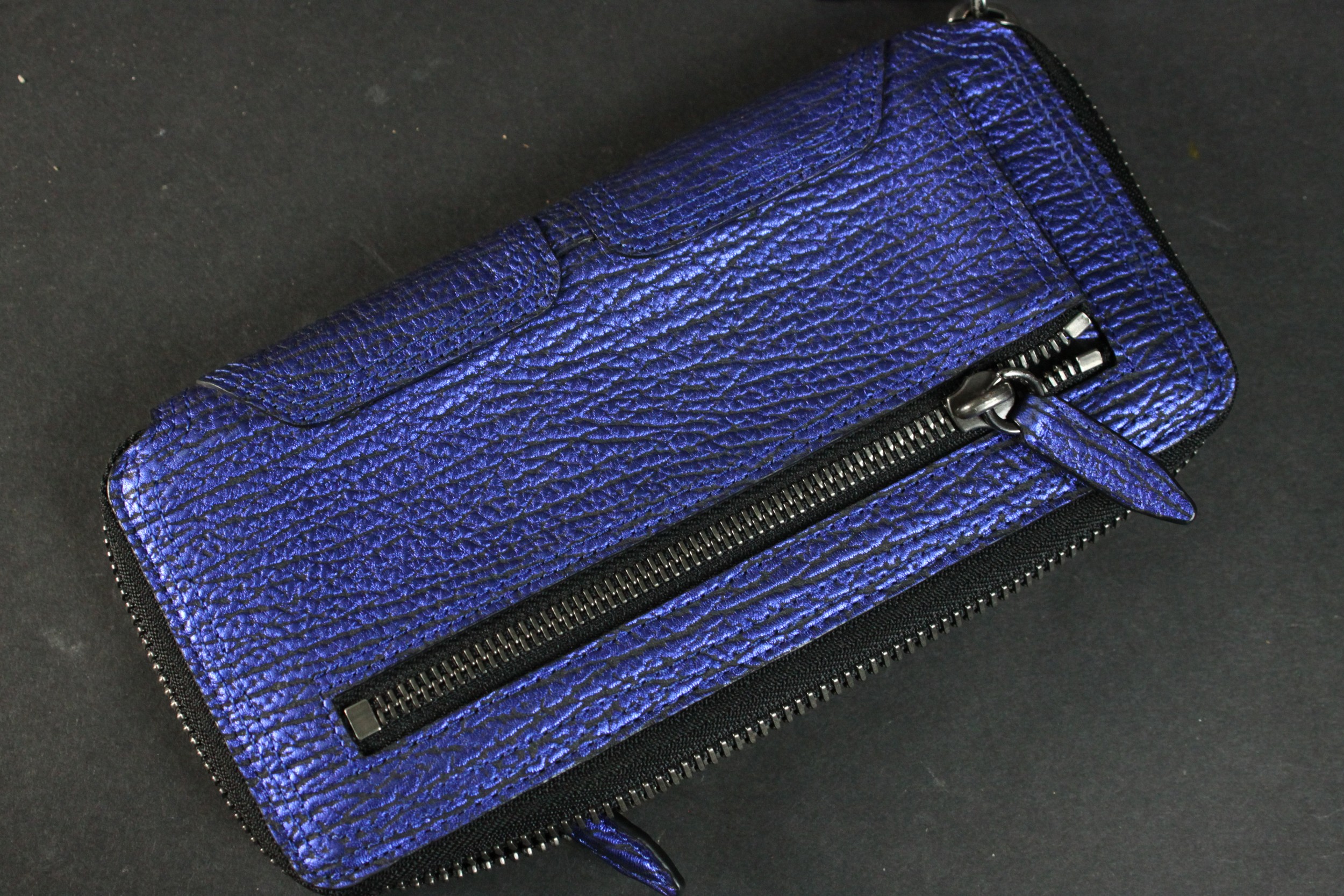 A vintage black silk Prada zip purse along with a Philip Lim metallic blue leather clutch bag. H. - Image 5 of 6