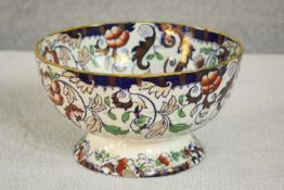 An Amhurst Japan Ironstone ceramic bowl with stylised floral design, stamp to base. H.14 Dia.24cm.