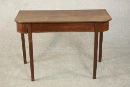 A George III mahogany D shaped console table, the top with a reeded edge on square section