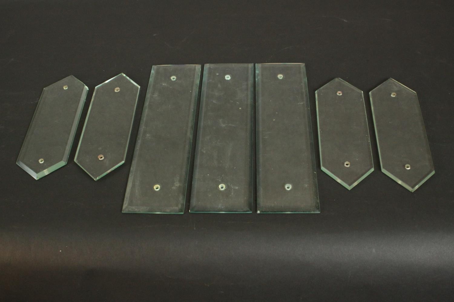 A collection of seven Victorian bevelled glass door plates. H.32 W.8.5cm. (largest)