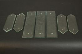 A collection of seven Victorian bevelled glass door plates. H.32 W.8.5cm. (largest)