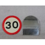 A 30 mile an hour speed limit enamel sign along with an arched bevelled plate wall mirror. Diam.60cm
