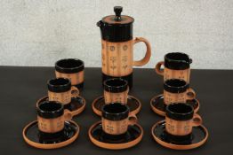 Gordon Fox for Kentmere pottery; a stoneware coffee set to seat six, with dark brown glaze and