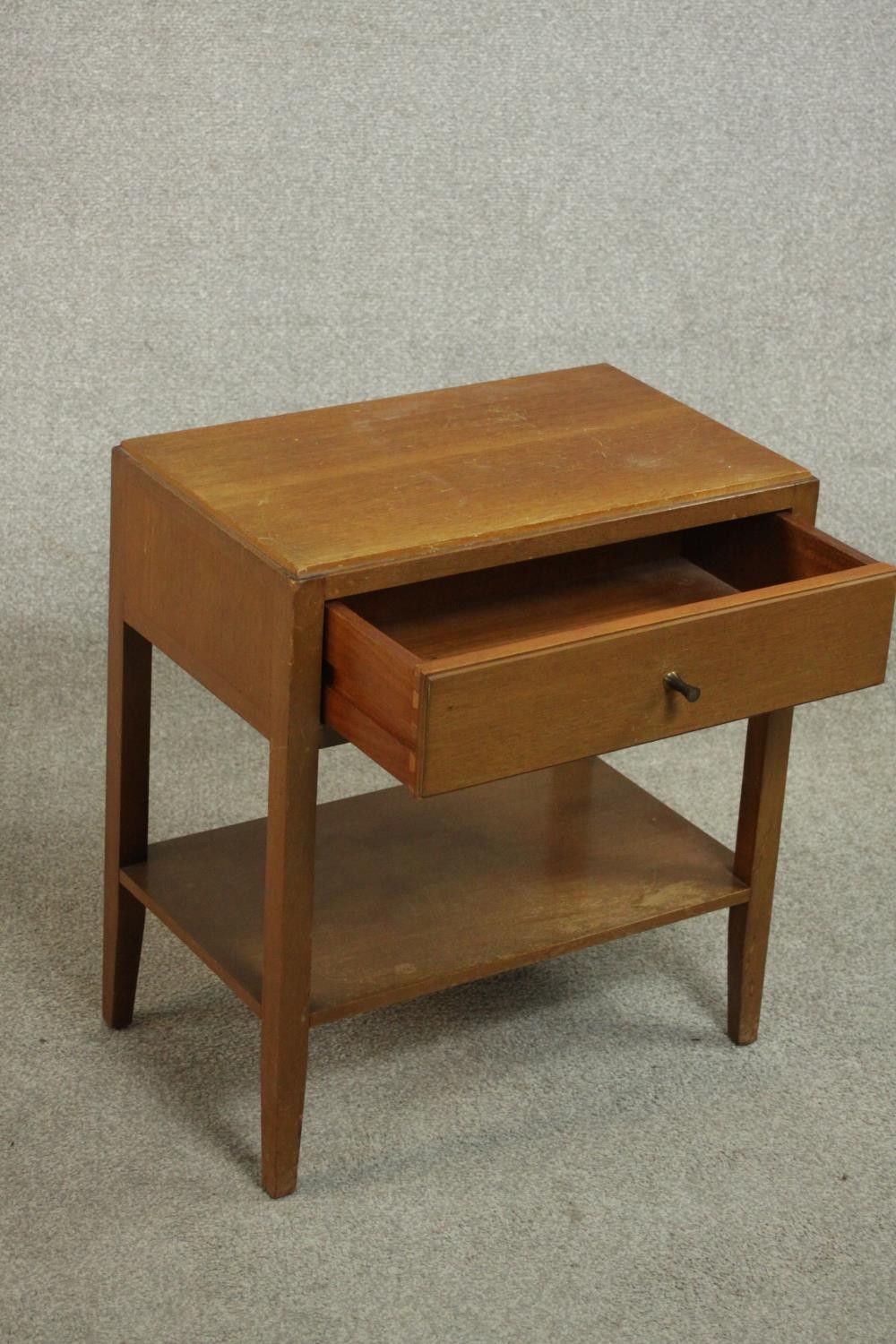 A mid 20th century Heal's style oak bedside table, with a single drawer over an undertier on - Image 4 of 4