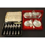 A collection of silver plate, including a set of six grapefruit spoons and a silver plated