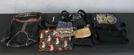 A collection of eleven designer handbags, including an Etro black leather hand bag, a Sonia Rykiel