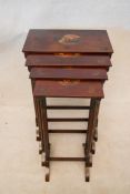 A quartetto nest of Regency style mahogany tables, each with rectangular tops hand painted with a