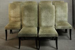 A set of ten contemporary dining chairs, upholstered in gold coloured fabric, on ebonised square