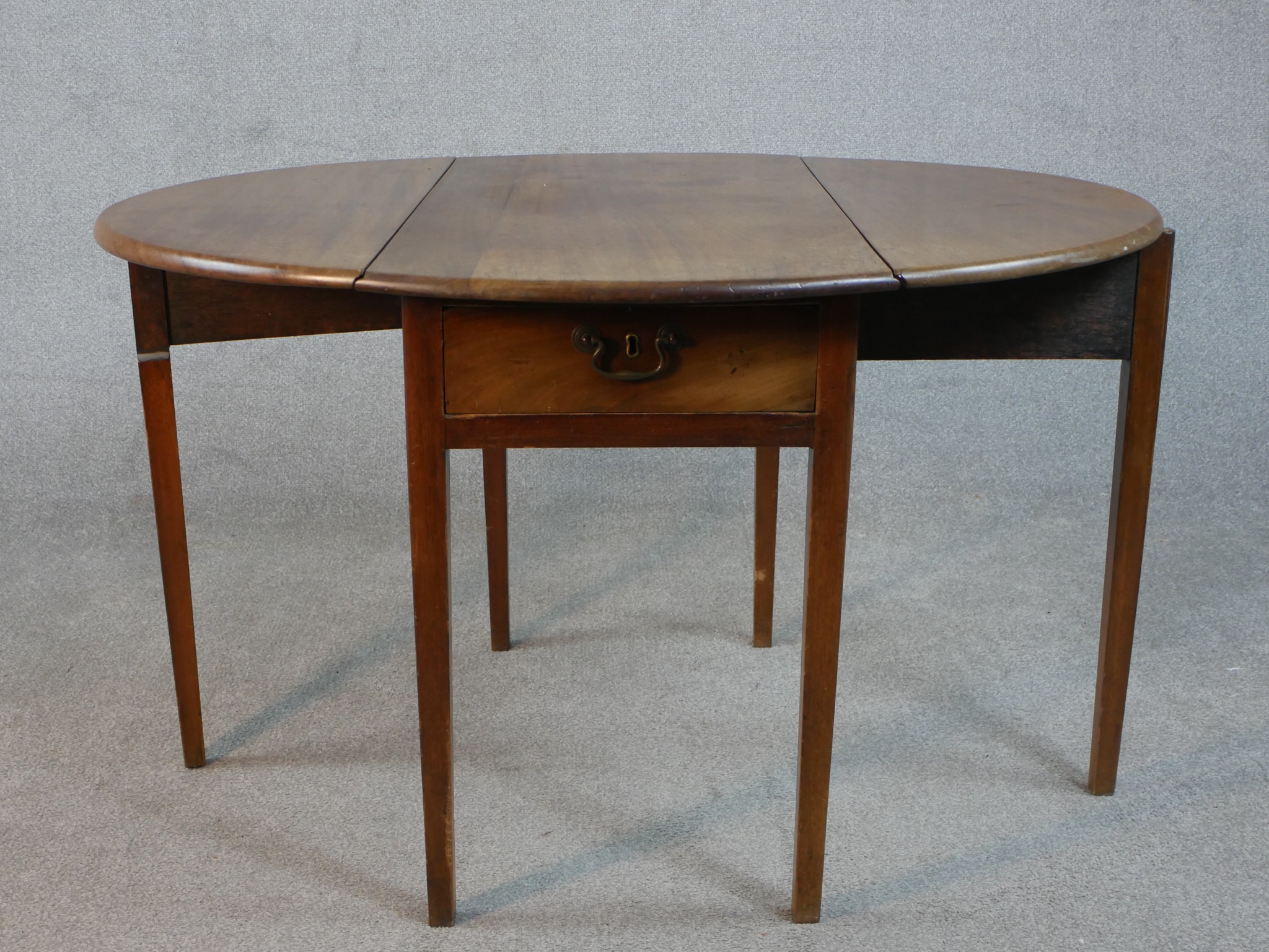 A Victorian walnut Pembroke table, with two drop leaves over a single end drawer, on square