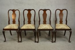 A set of four circa 1930s Queen Anne style walnut dining chairs, with a vase splat back over a