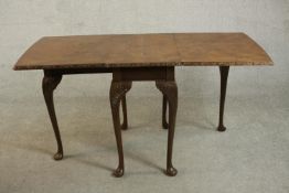A George II style burr walnut drop leaf dining table, circa 1920s, the top with two drop leaves
